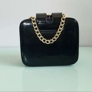 Black purse with gold chain